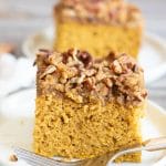 Two slices of pumpkin coffee cake on white plates.