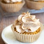 A gluten free cupcake on a small white plate.