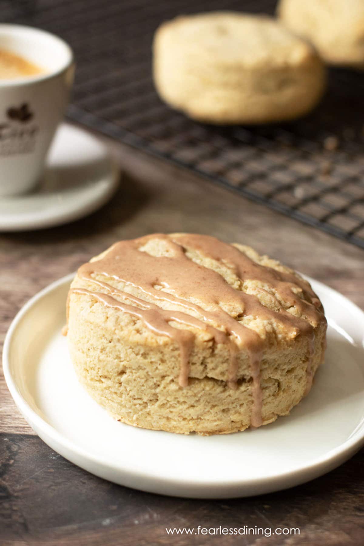 a gluten free pumpkin spice scone on a white plate