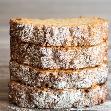 A stack of four slices of gluten free spice cake.