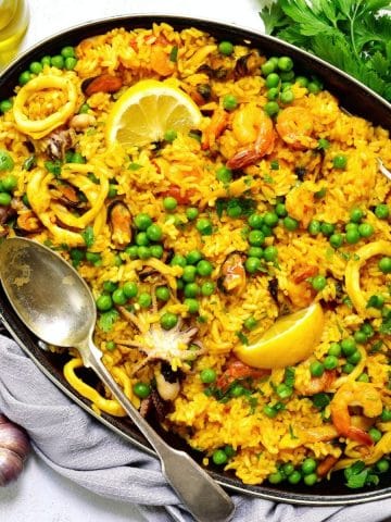 a pan full of paella on a table