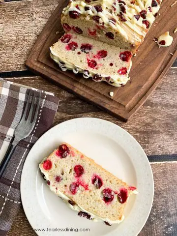 a slice of gluten free cranberry cake on a plate