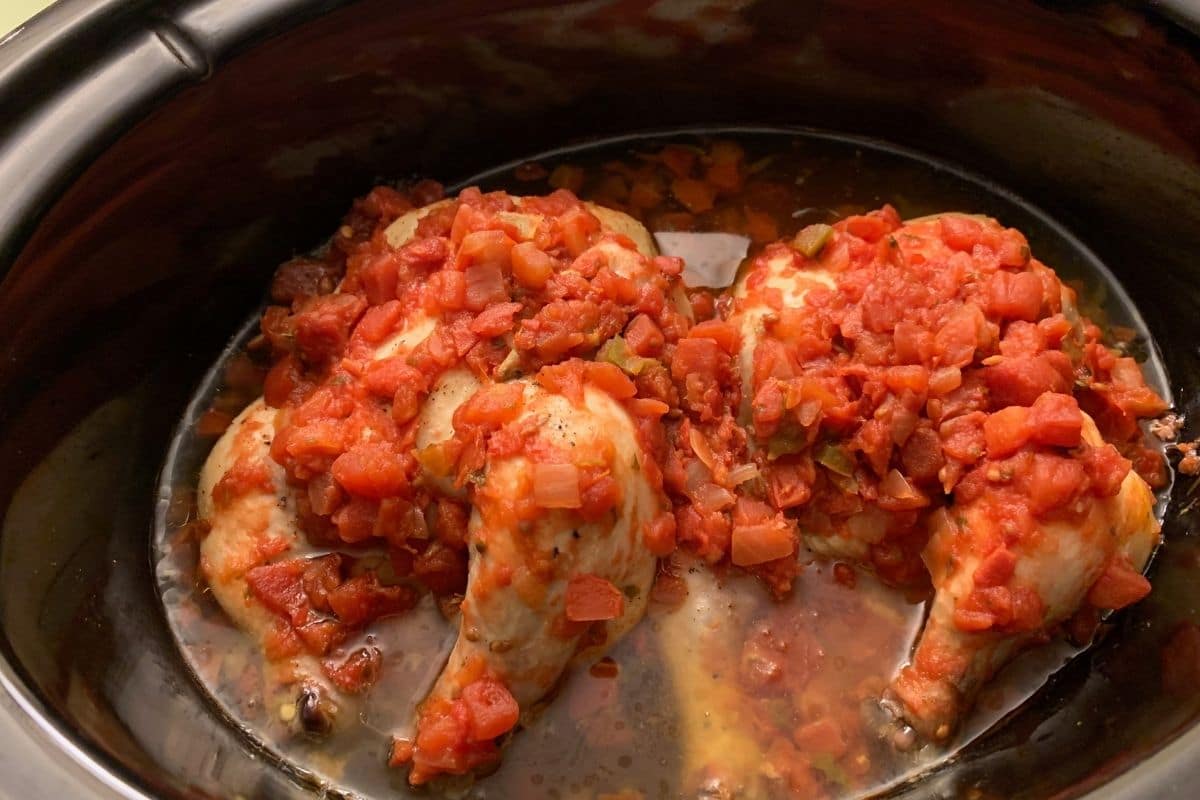 Two cornish hens with Rotel in the slow cooker ready to cook.