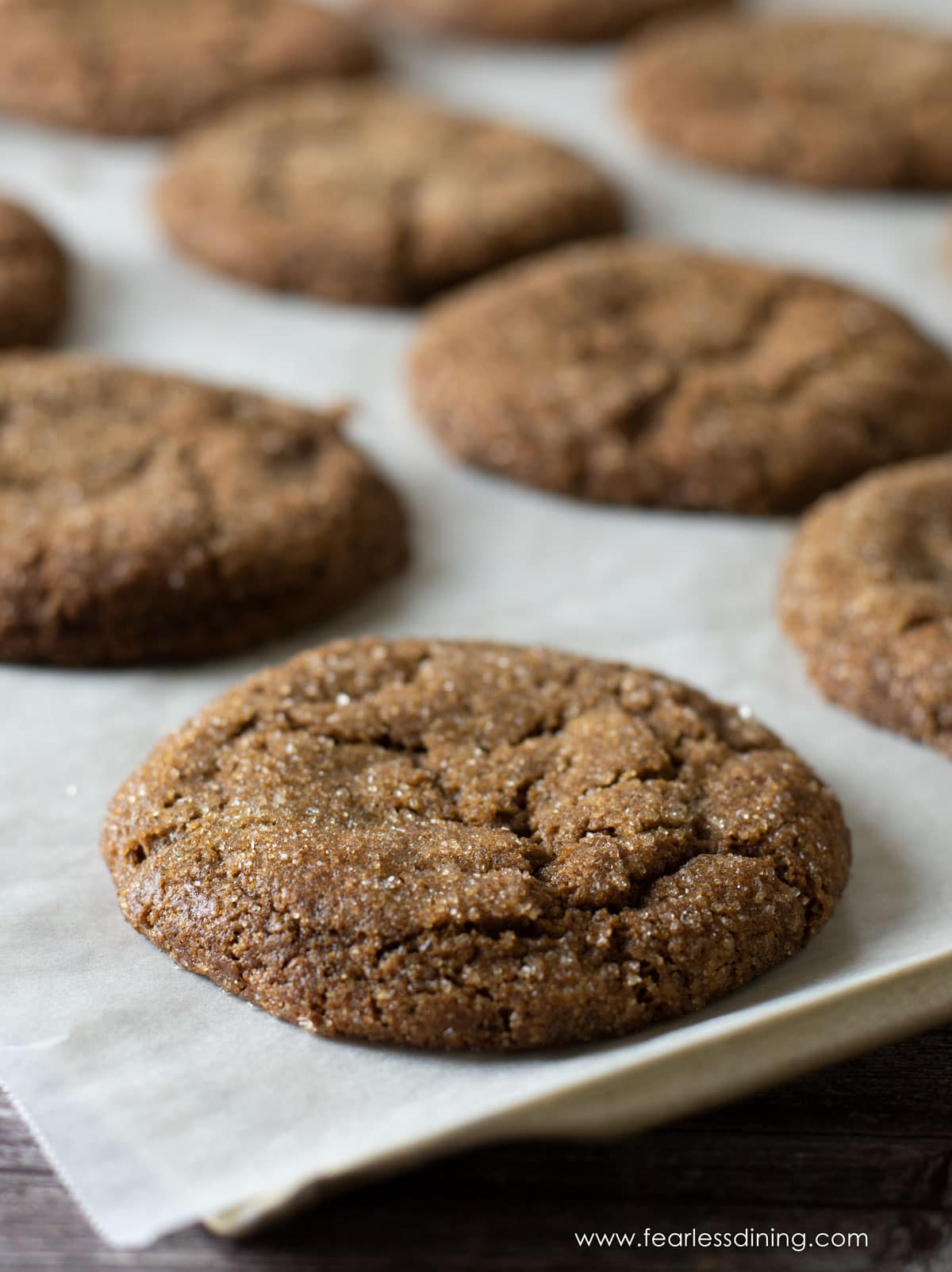 Baked gingerdoodles on the cookie sheet.