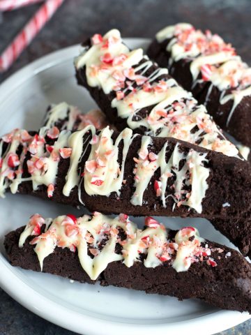 a plate with four chocolate peppermint biscotti slices.