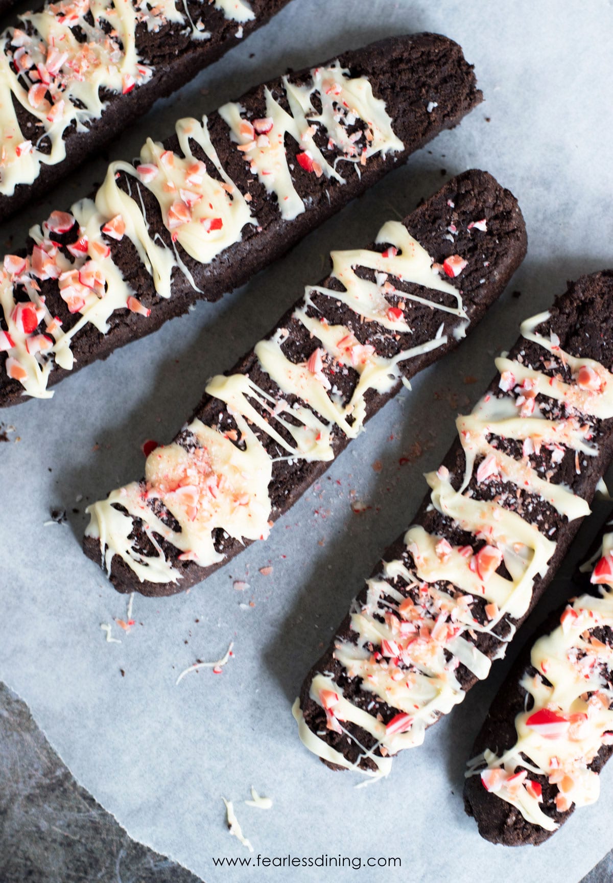 Chocolate biscotti with white chocolate and crushed candy canes pieces.