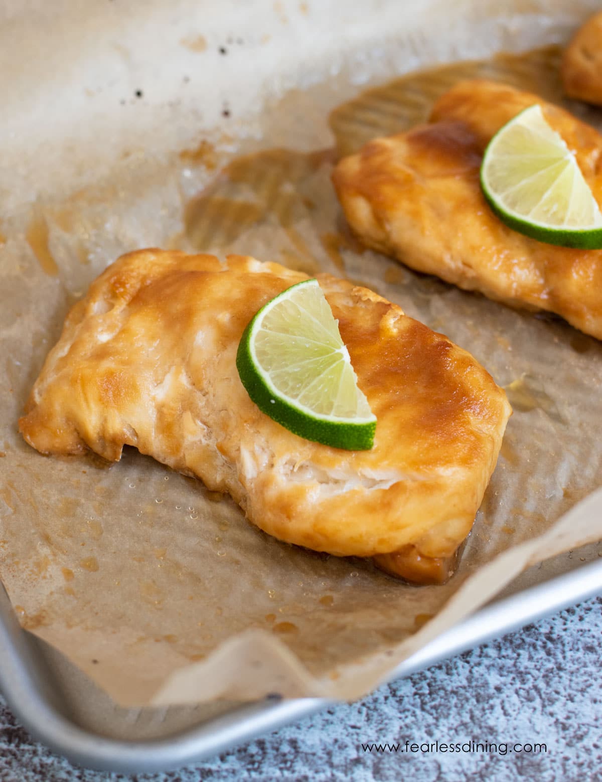 Baked glazed cod in a baking dish.