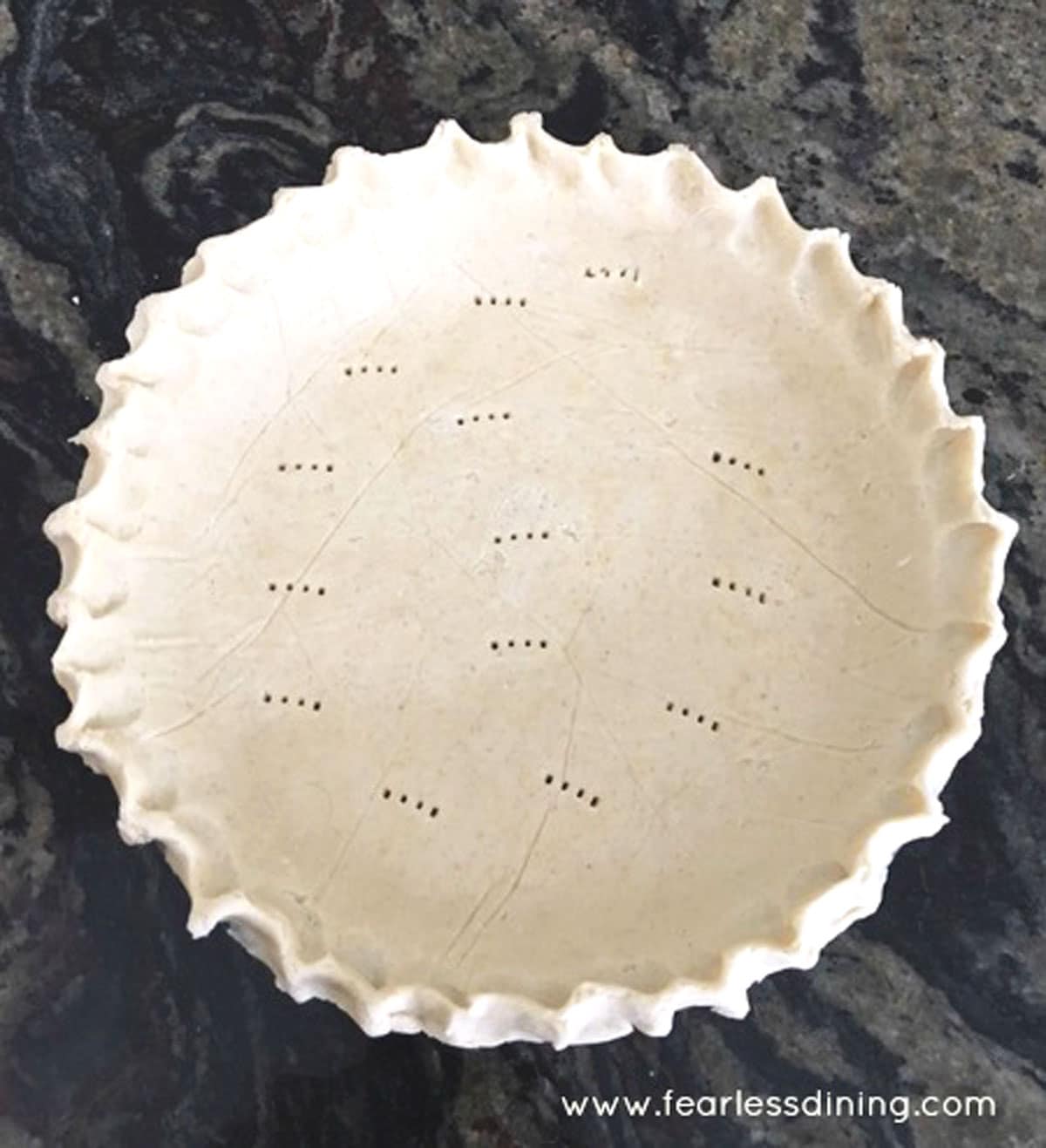 A pie crust ready to bake.