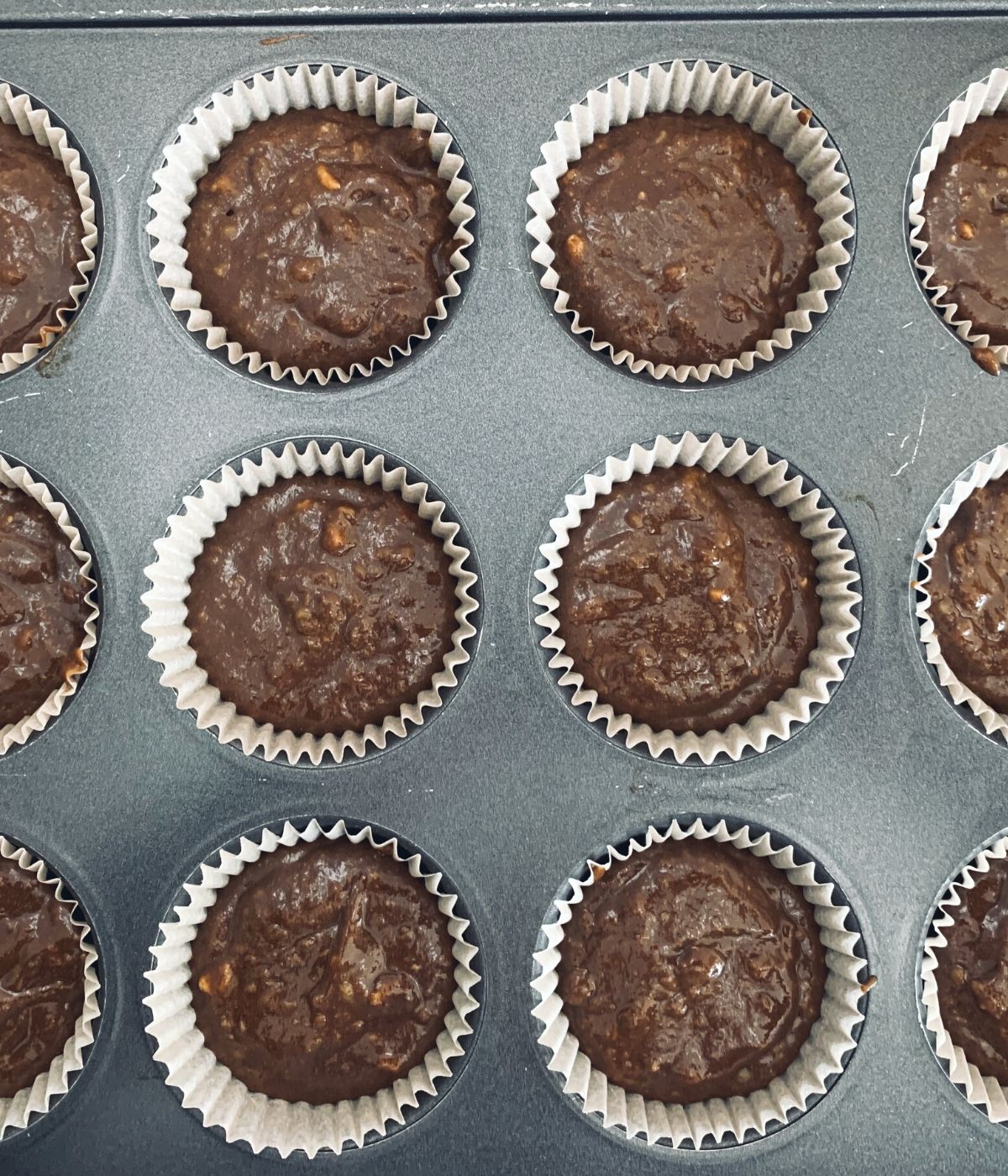 A photo of the cupcake batter in the muffin tin ready to bake.