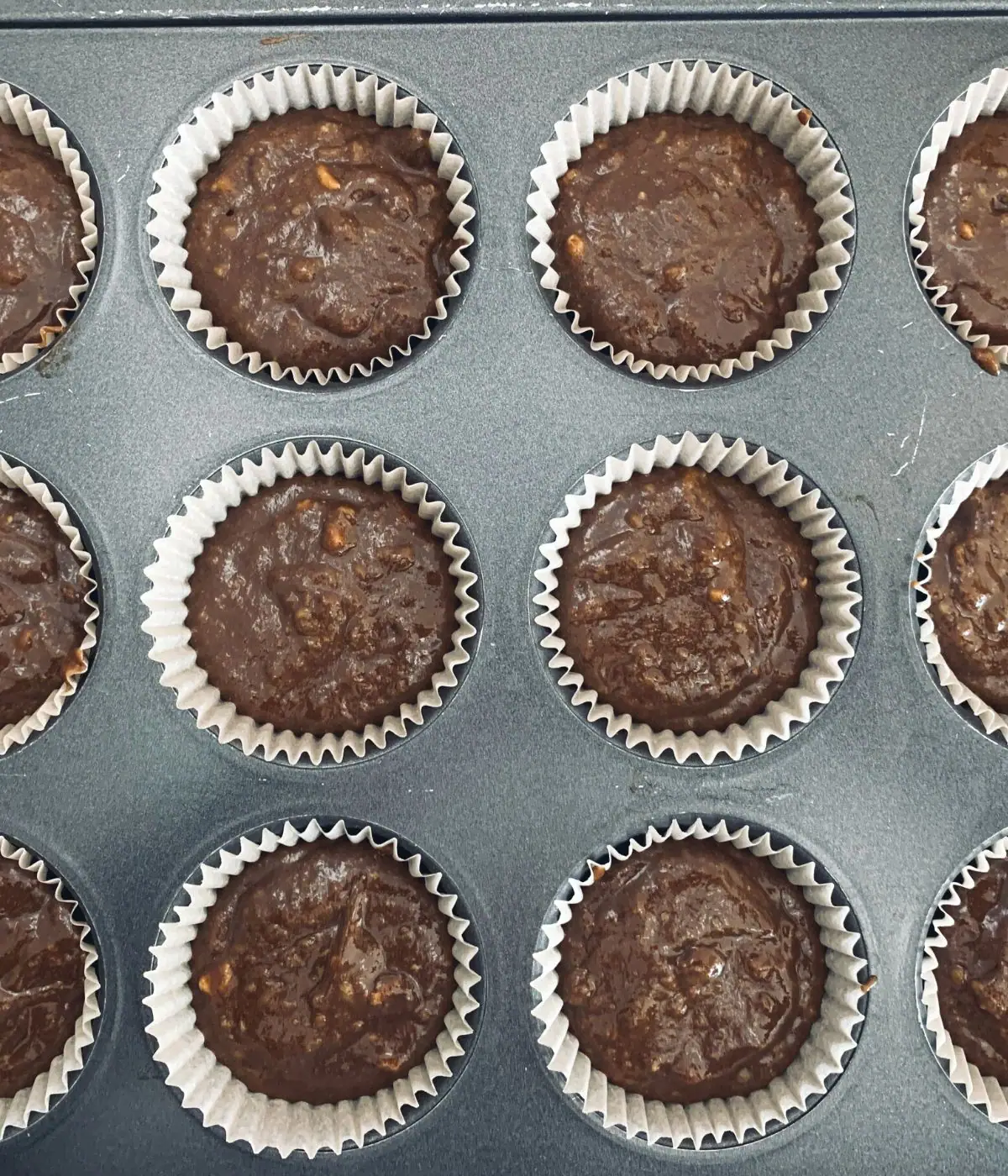 A photo of the cupcake batter in the muffin tin ready to bake