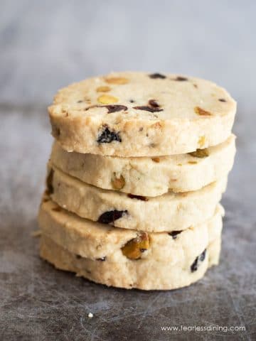 A stack of four gluten free cranberry shortbread cookies.