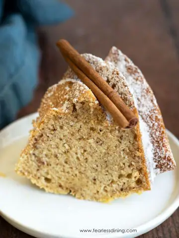 A slice of gluten free eggnog bundt cake on a white plate