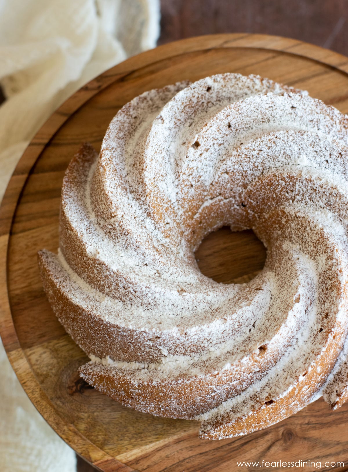 the top view of an eggnog bundt cake dusted in powdered sugar.