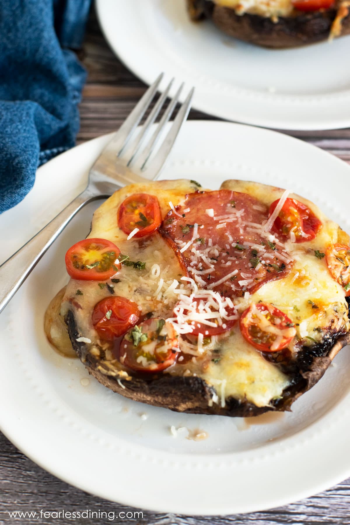 An air fryer portobello pizza on a plate.