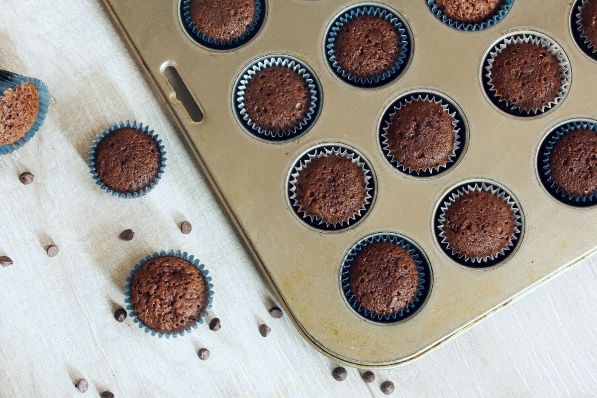 Baked mini brownies in a tin.