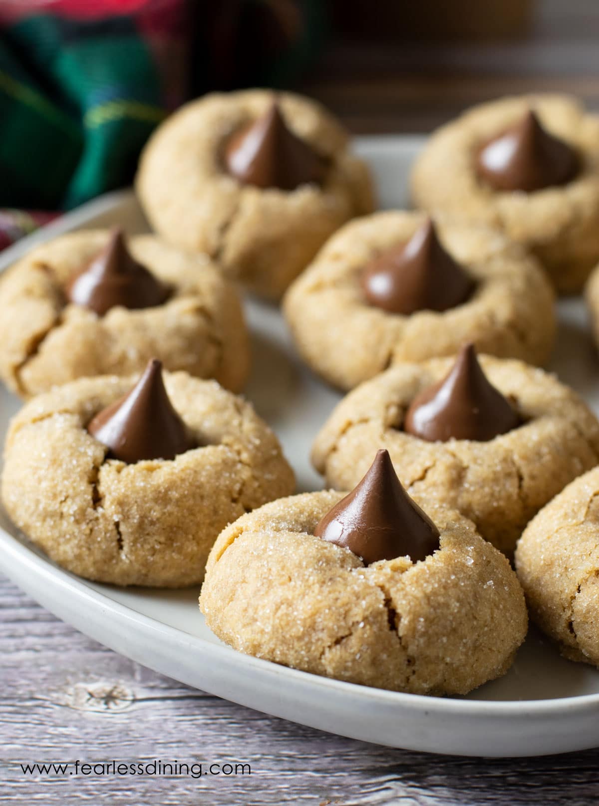 A plate full of gluten free peanut butter blossoms.