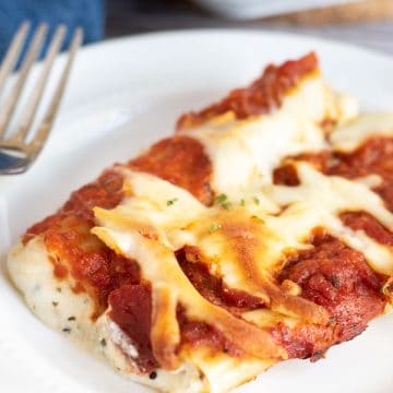 a plate with two cheese stuffed manicotti