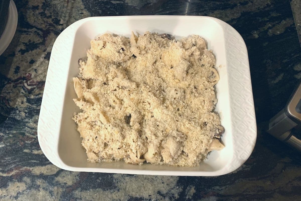 A casserole dish filled with unbaked tuna casserole.