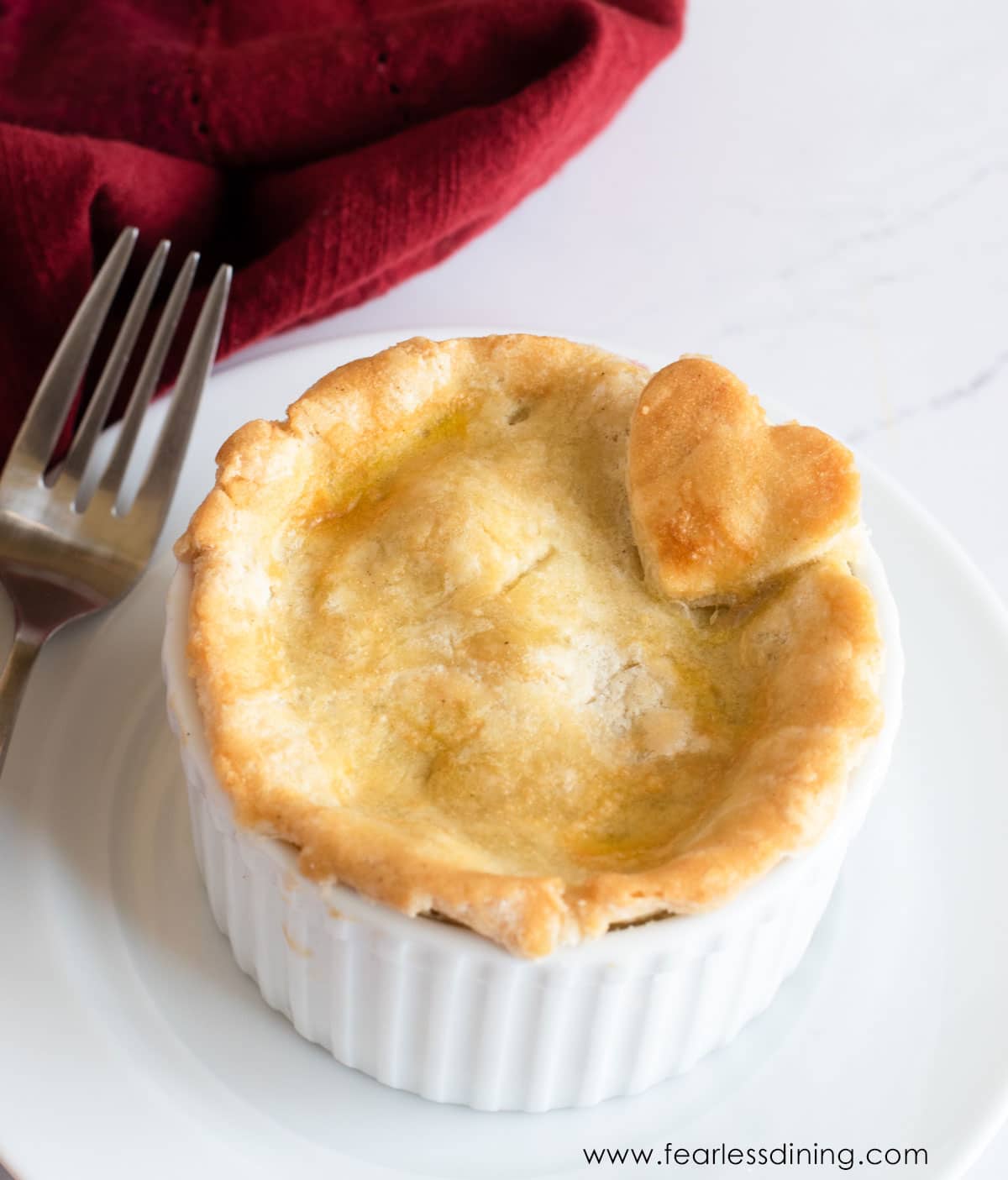 A little gluten free strawberry pie in a ramekin.