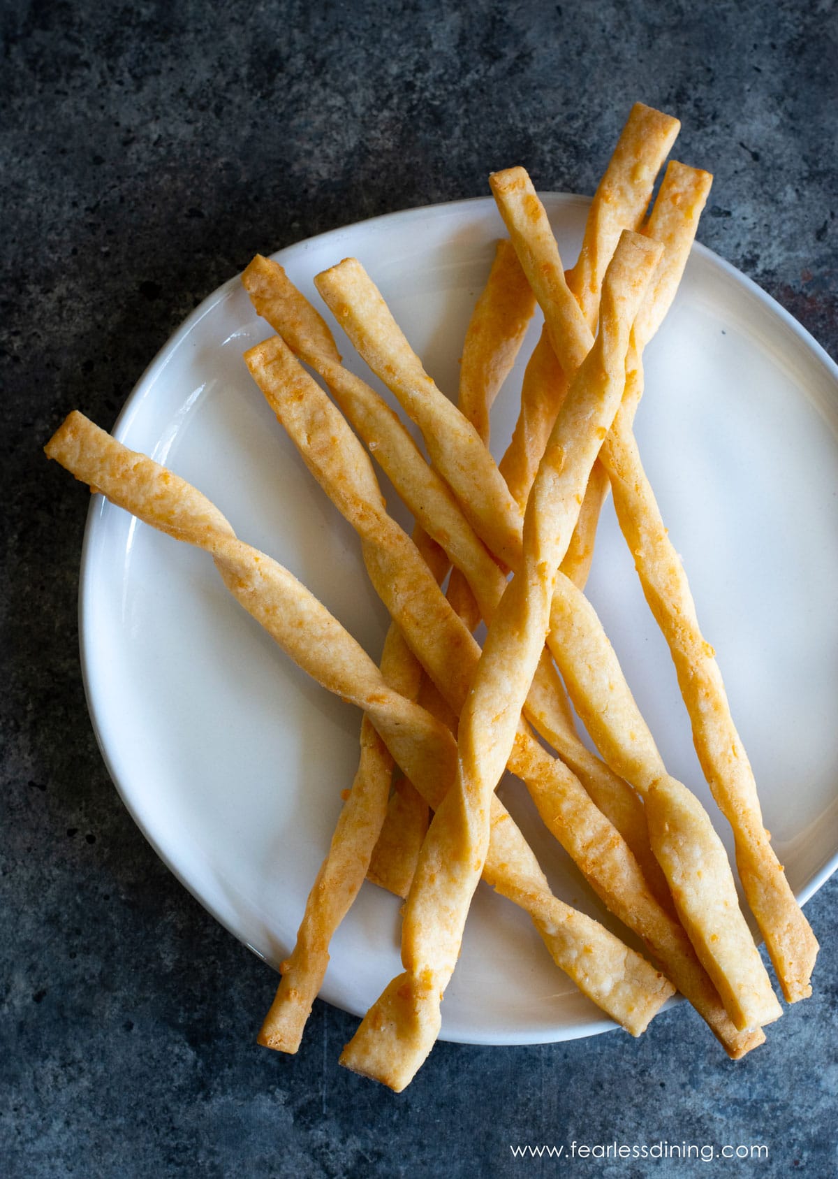 The gluten free cheese twists on a plate.