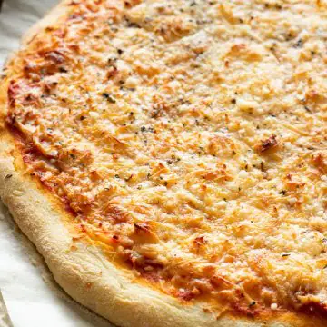 a gluten free pizza on a baking sheet
