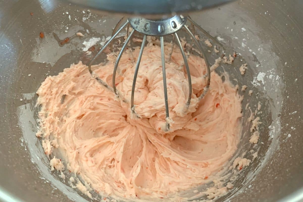 Strawberry frosting in the standing mixer.