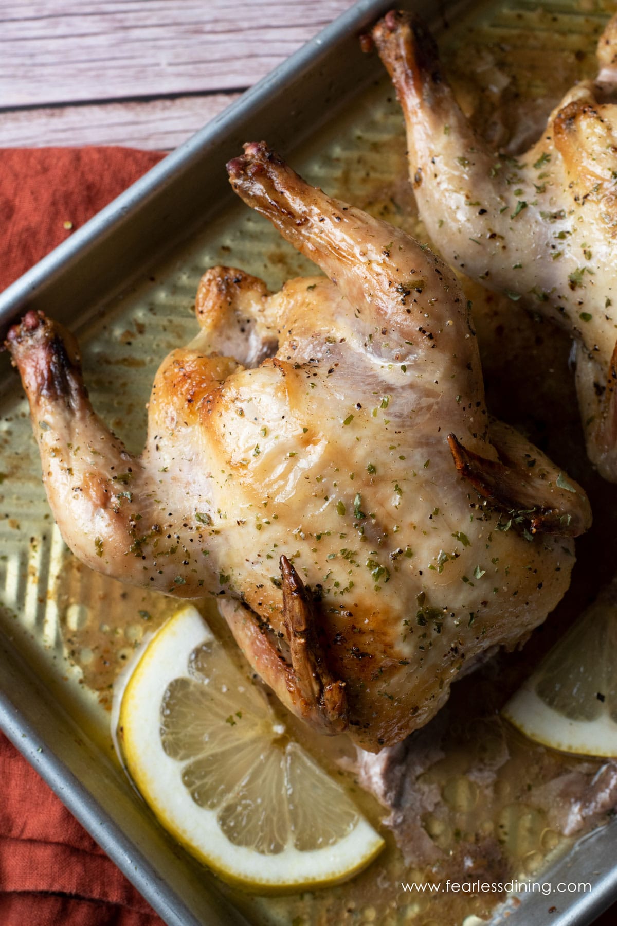 roasted game hens on a sheet pan