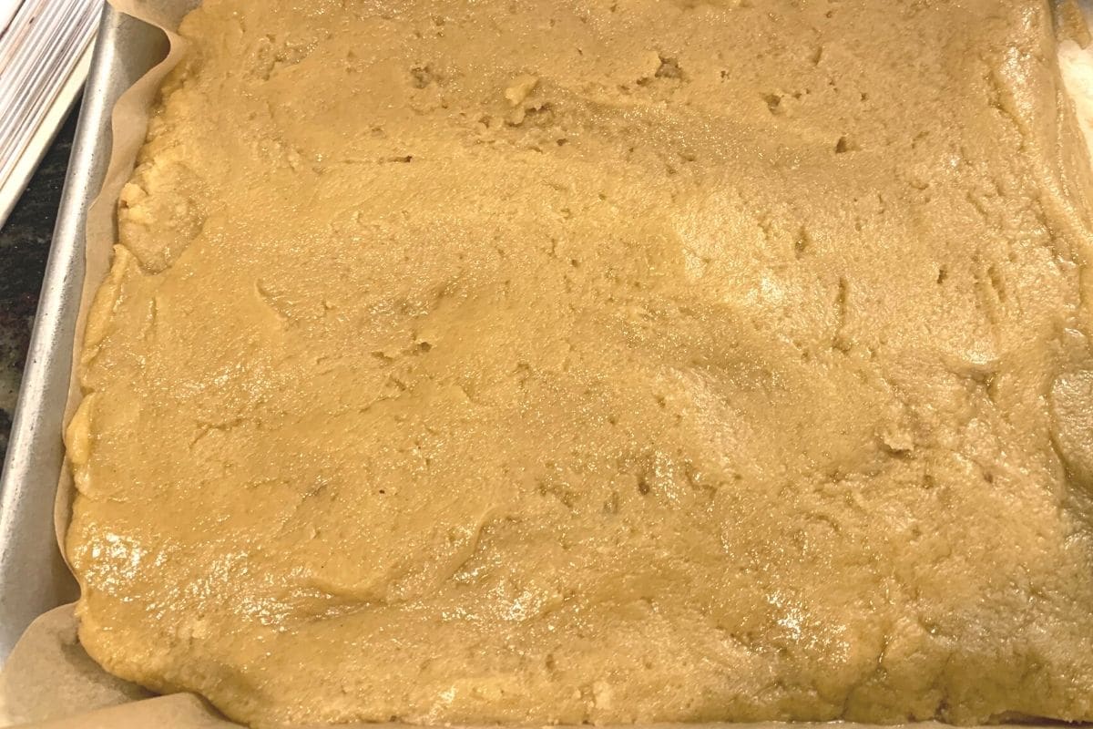 The blondie batter in a baking pan.