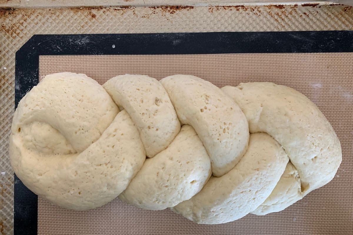 The braided challah dough after rising.