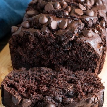 The front of a sliced loaf of chocolate banana bread.