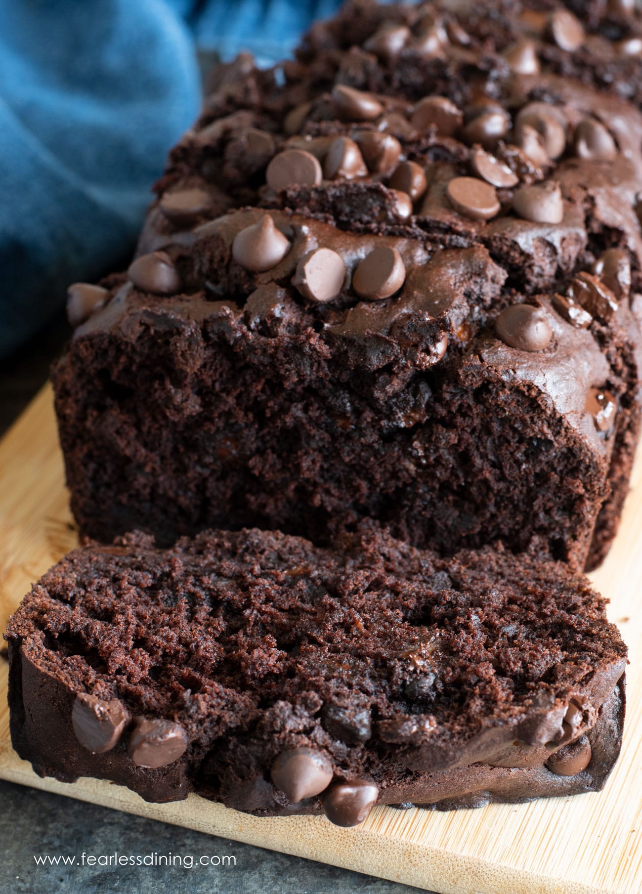 The front of a sliced loaf of gluten free chocolate banana bread.