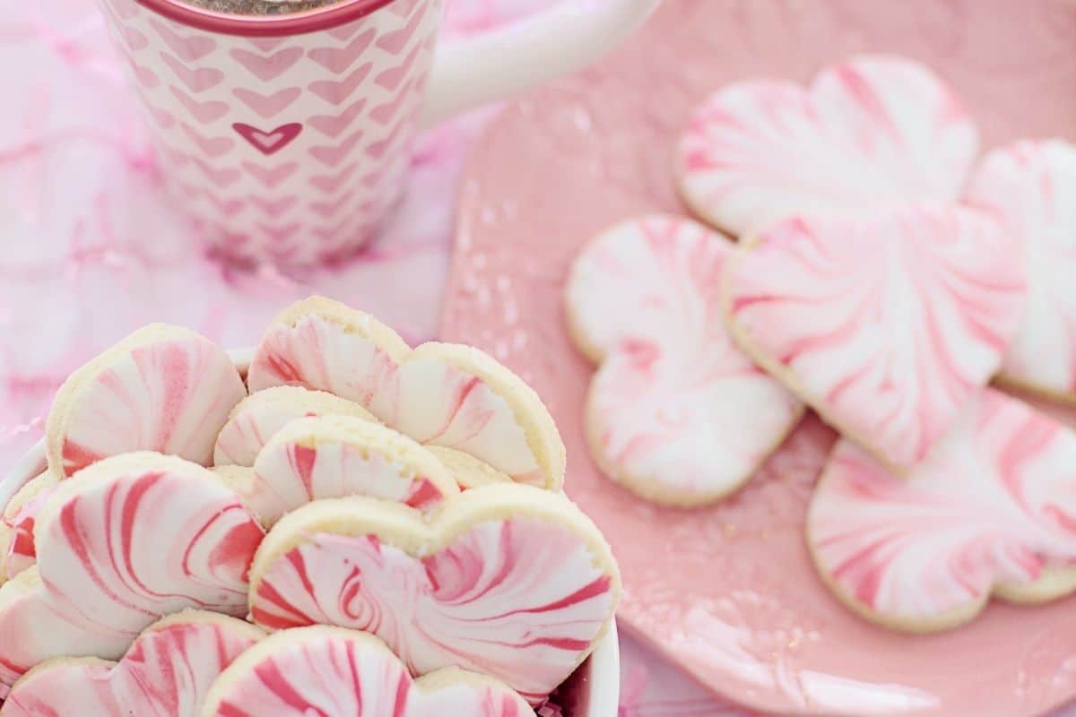 red and white decorated heart shaped cookies