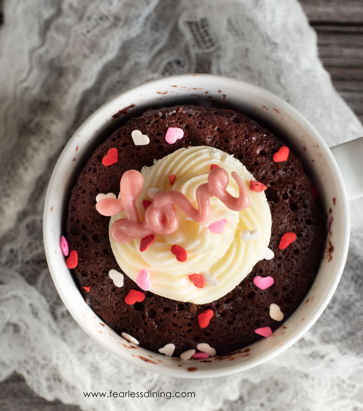 The top view of a gluten free red velvet mug cake.