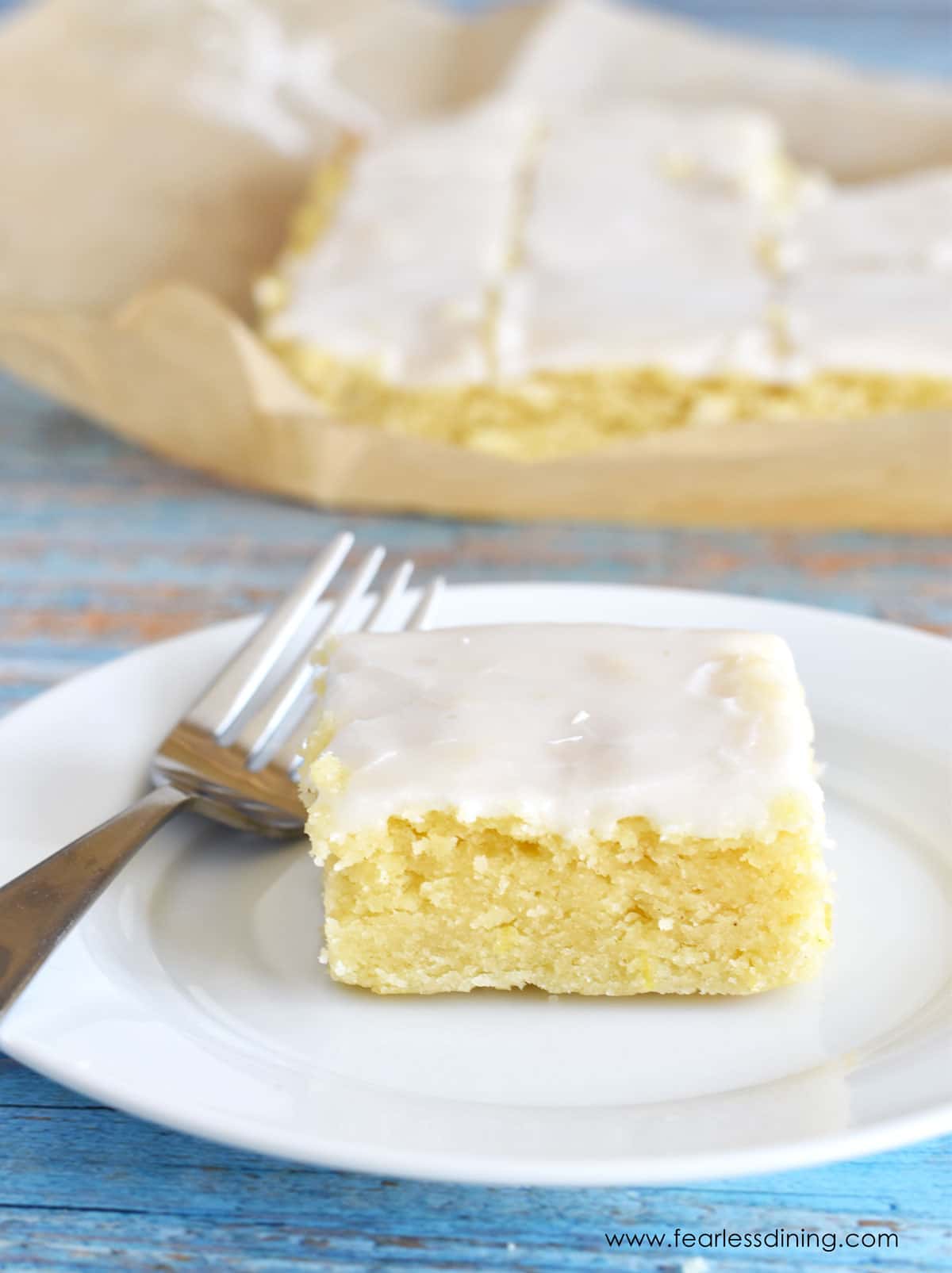 A gluten free lemon brownie on a plate.