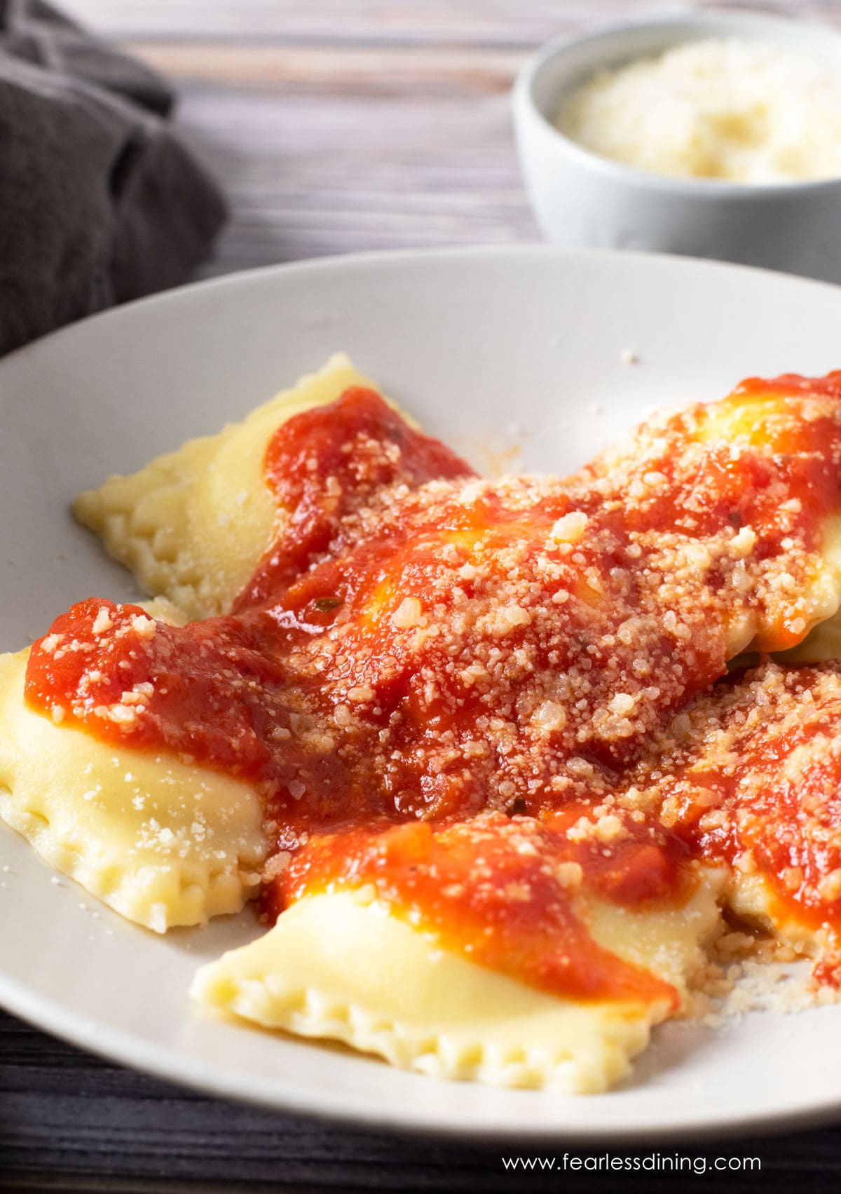 A plate of homemade gluten free ravioli with sauce.