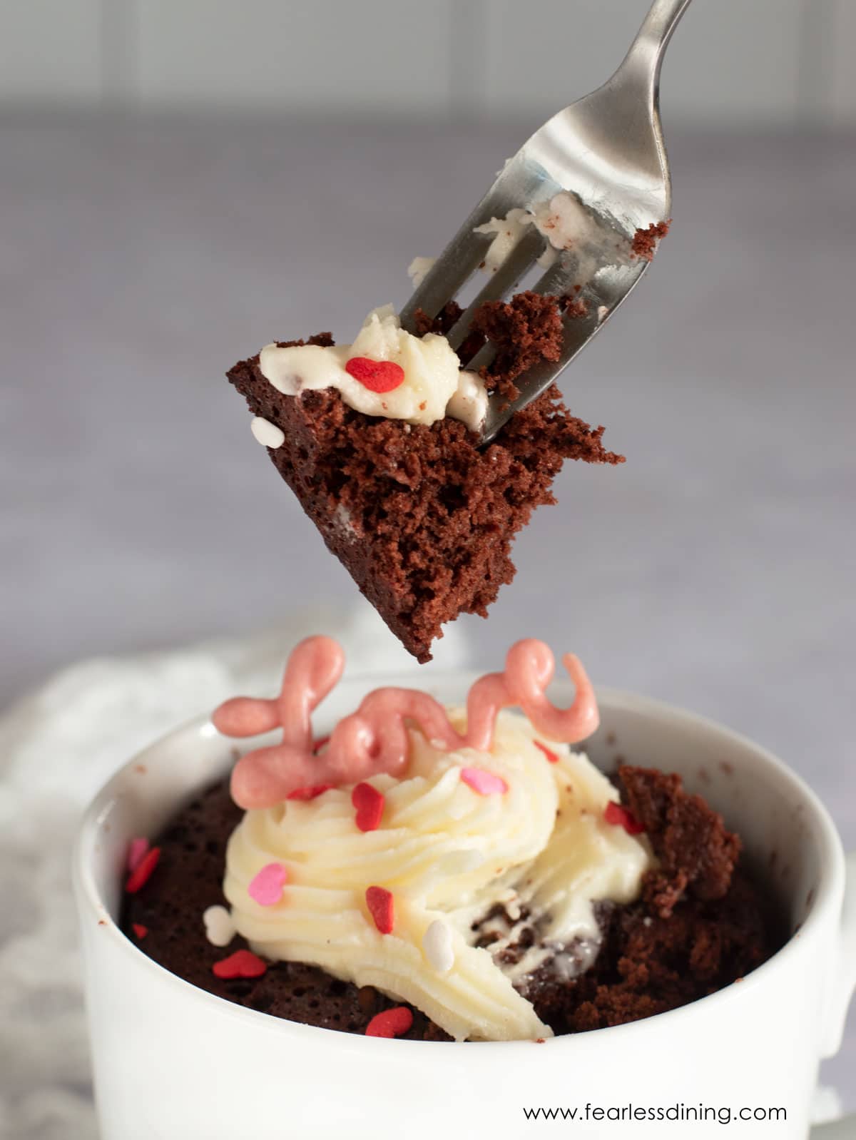 A fork full of the red velvet mug cake.