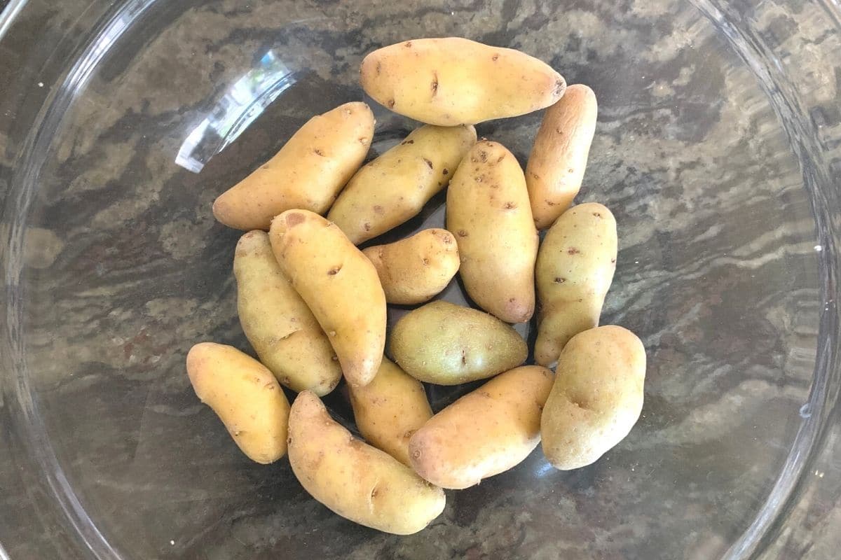 Washed fingerling potatoes in a bowl.