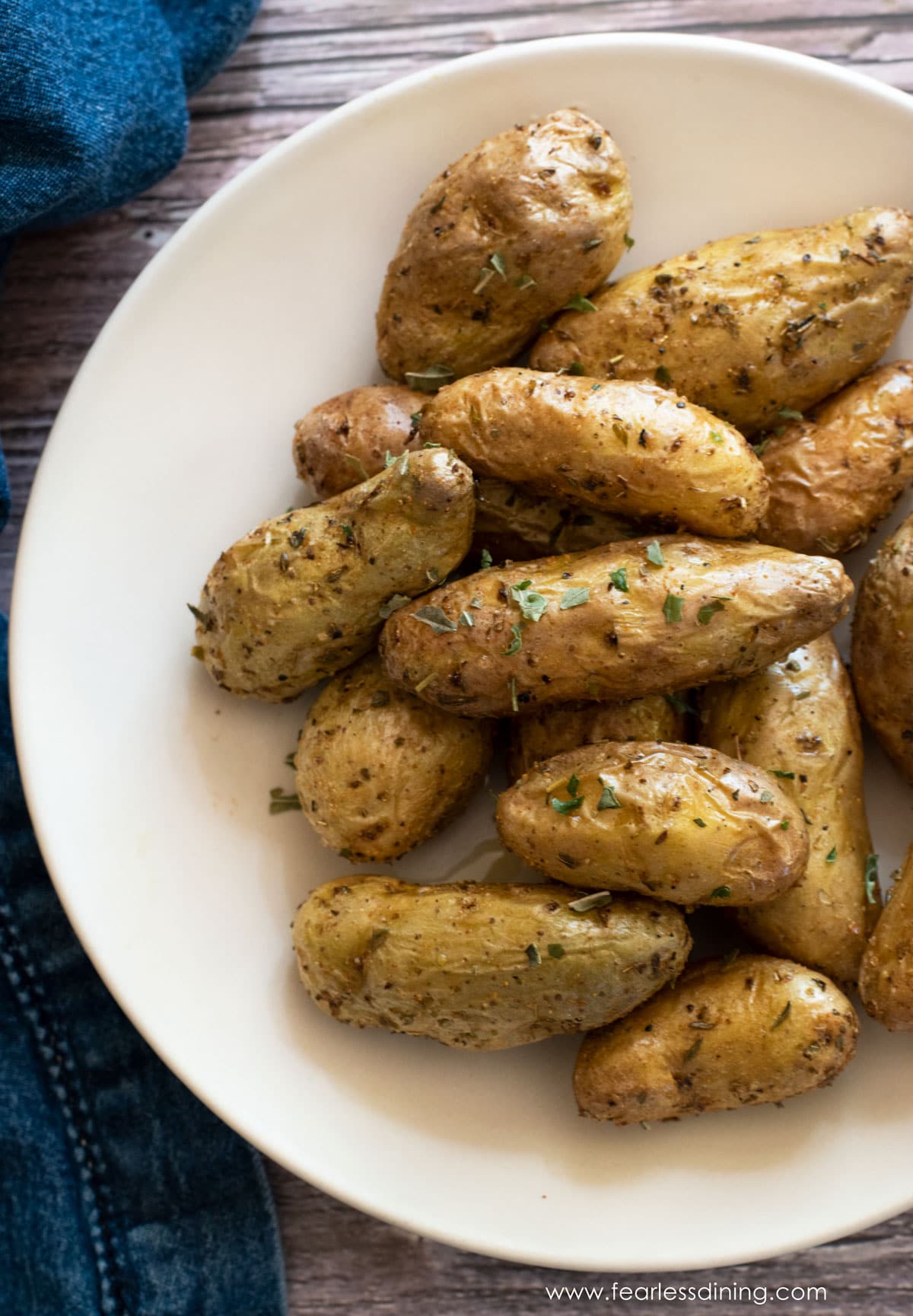 The top view of a bowl full of roasted fingerling potatoes.