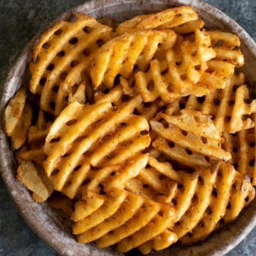 a top view of a large bowl of waffle fries.