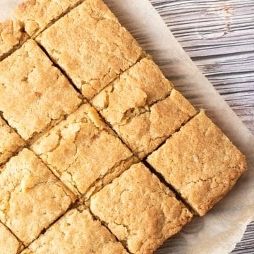 The cut brownies on parchment paper.