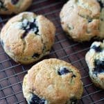 Gluten-free blueberry scones on a cooling rack.