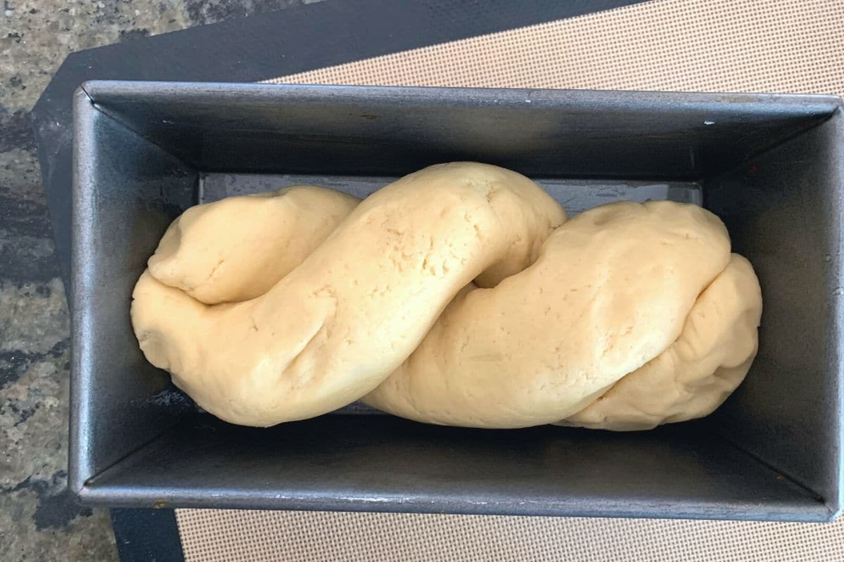 The twisted gf brioche dough in the loaf pan.