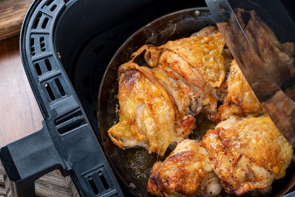 Cooked chicken in an air fryer.