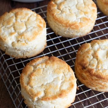 Gluten-free Bisquick biscuits cooling on a wire rack.