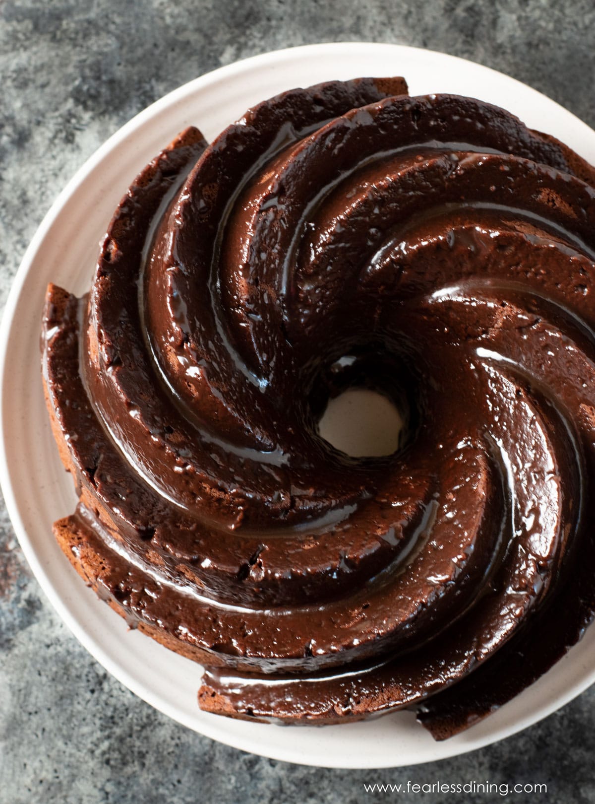 The top view of a chocolate pound cake topped in chocolate ganache.