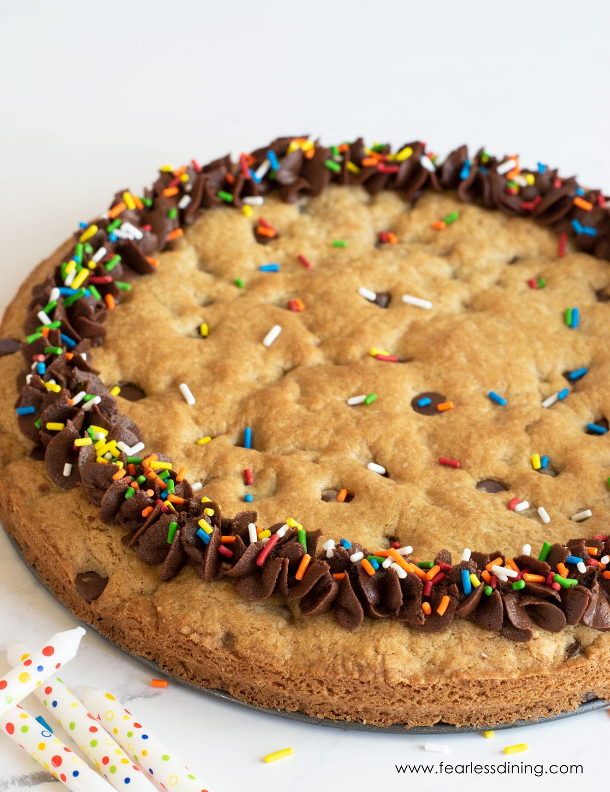 An angled view of the cookie cake.