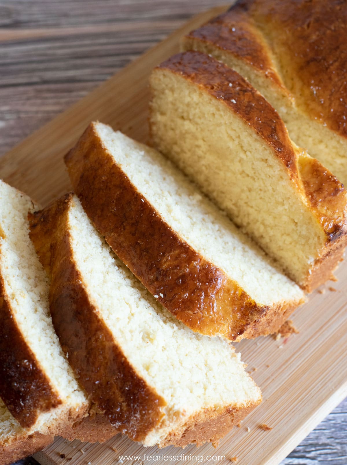 Sliced gf brioche on a cutting board.