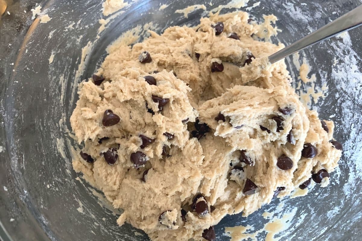 A mixing bowl filled with cookie dough.