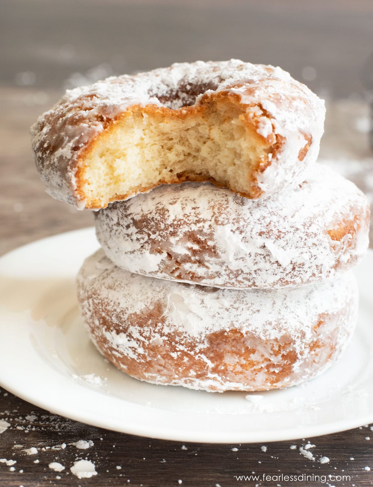 A stack of gluten free fried donuts.