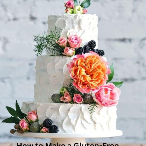 A gluten-free wedding cake decorated with flowers.